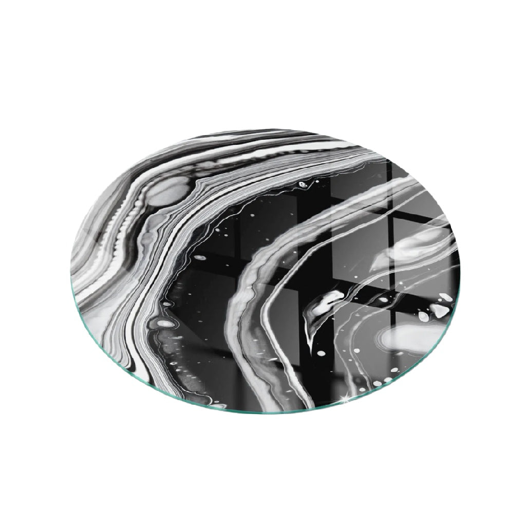 Dessous de verre rond en verre avec motif marbré noir et blanc
